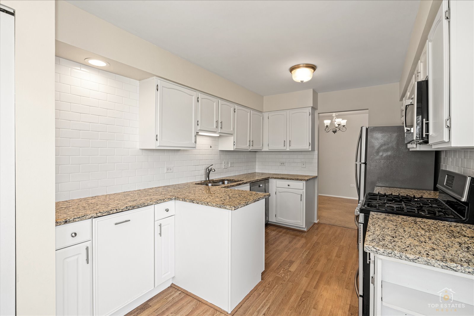 1427 Sutton Court, Unit 1427 Vernon Hills, IL 60061 - Photo 12 of 27 a kitchen with a refrigerator sink and stove