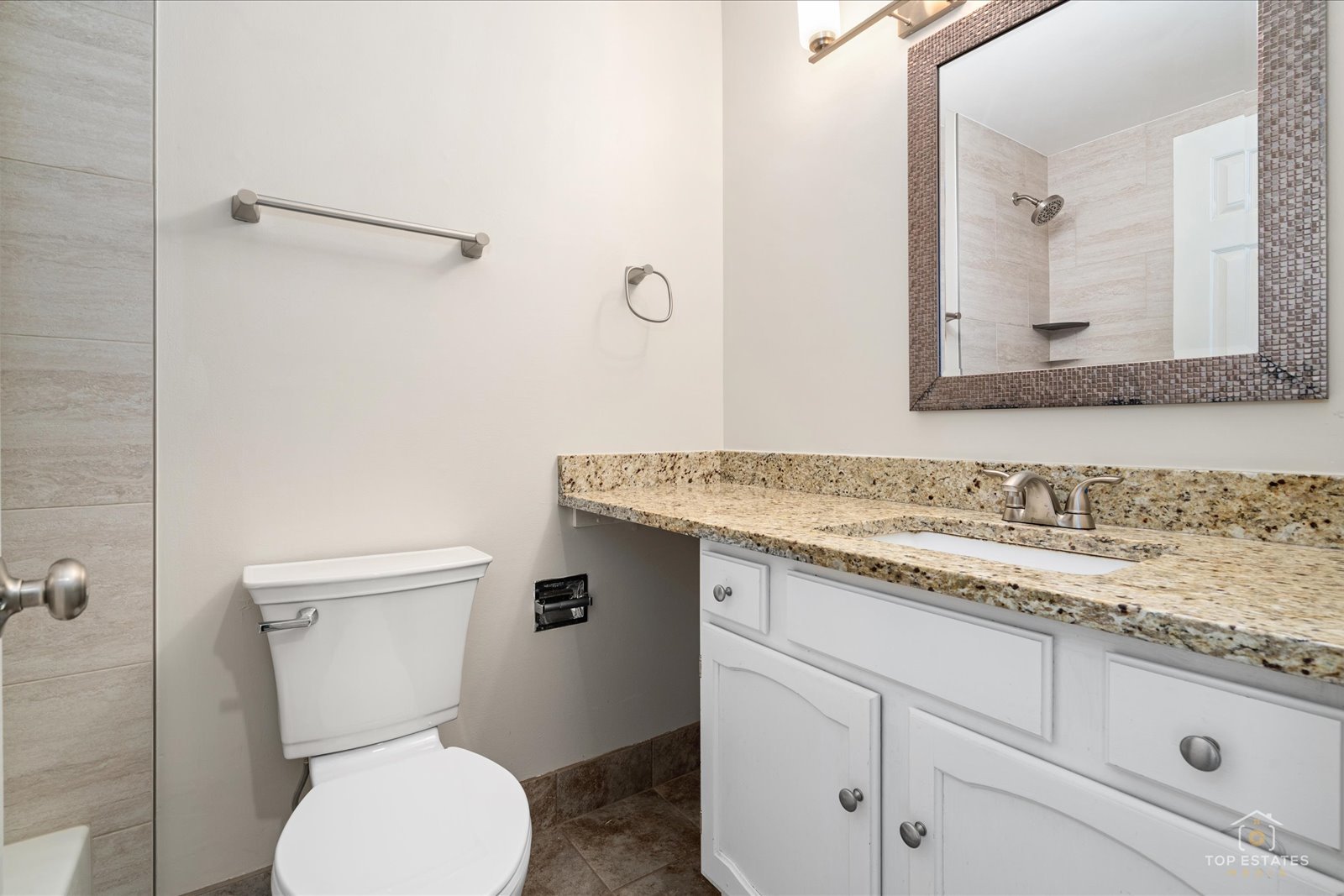 1427 Sutton Court, Unit 1427 Vernon Hills, IL 60061 - Photo 21 of 27 a bathroom with a granite countertop toilet sink and mirror