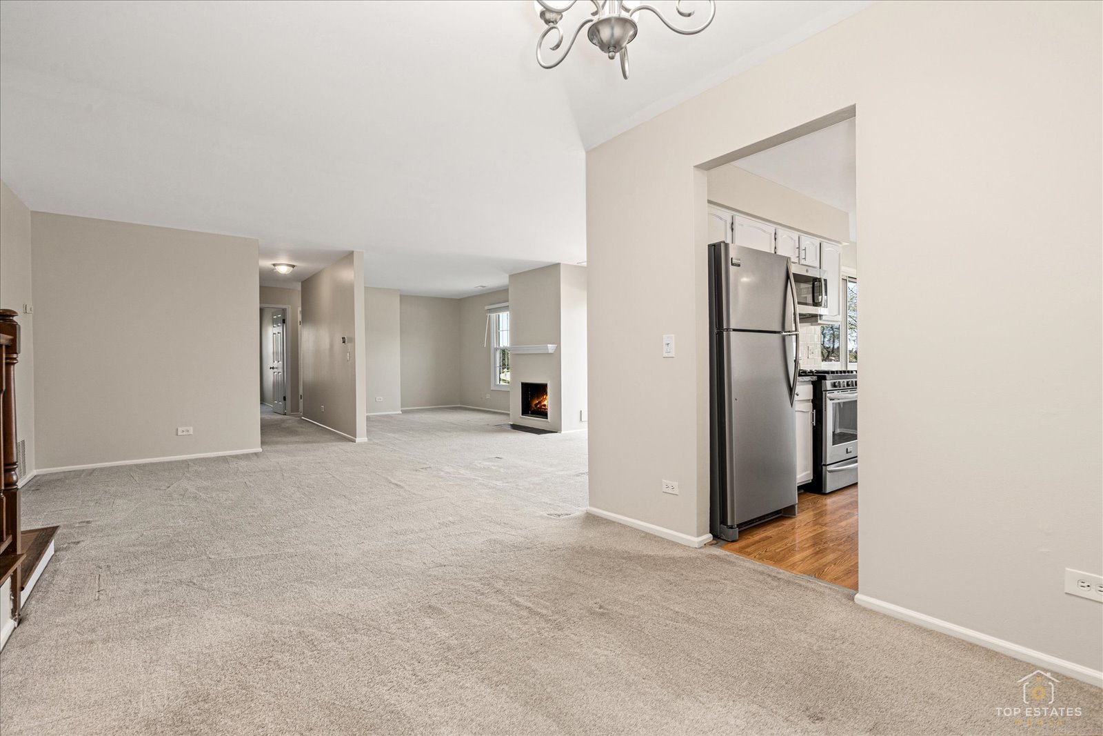 1427 Sutton Court, Unit 1427 Vernon Hills, IL 60061 - Photo 8 of 27 a view of a kitchen with a refrigerator and a sink