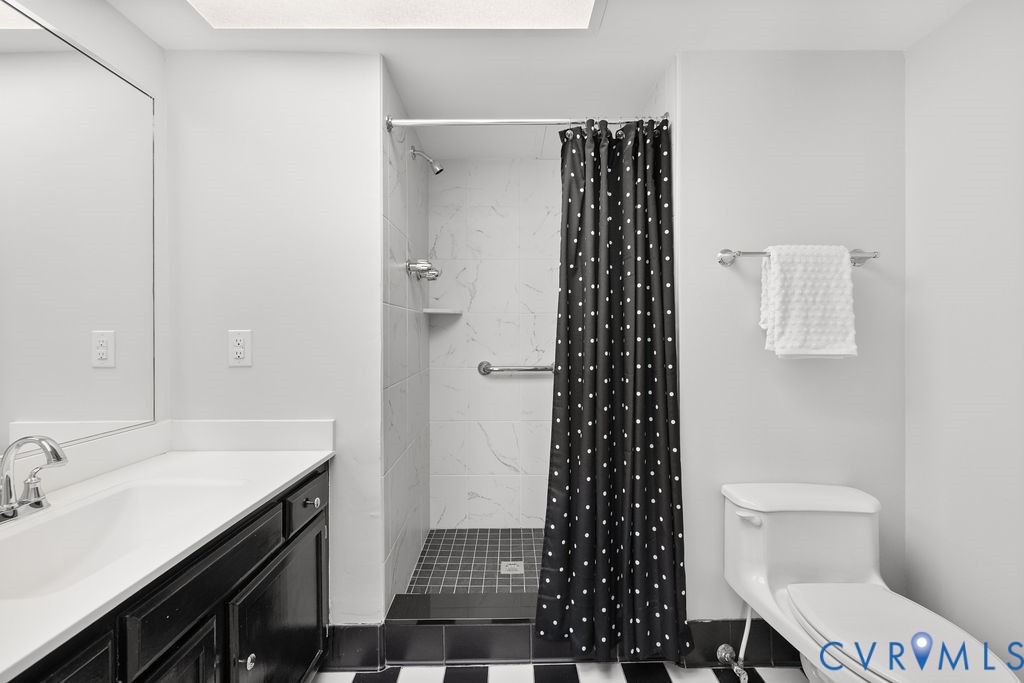 2956 Hathaway Road, Unit U704 Richmond, VA 23225 - Photo 21 of 42 Bathroom featuring a walk-in shower with white til