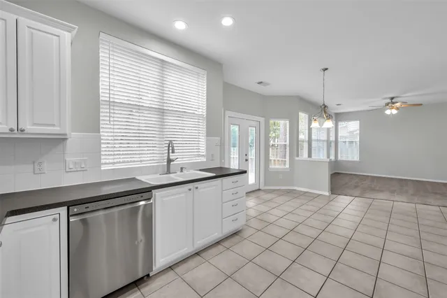 a view of balcony with wooden floor and fence