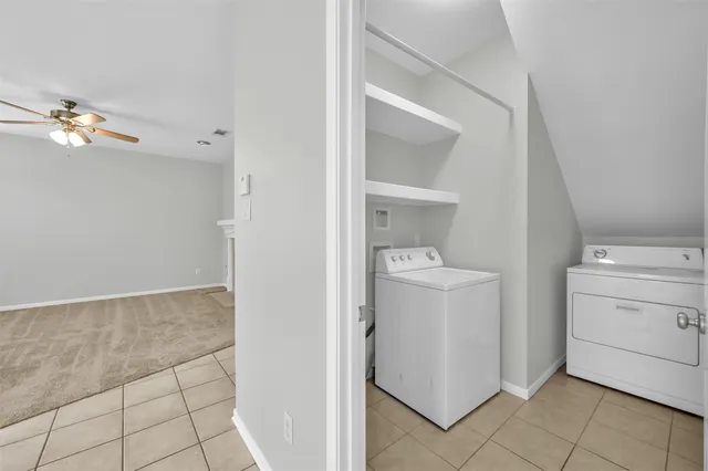 a kitchen with stainless steel appliances granite countertop a sink and a refrigerator