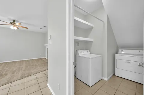 a kitchen with stainless steel appliances granite countertop a sink and a refrigerator