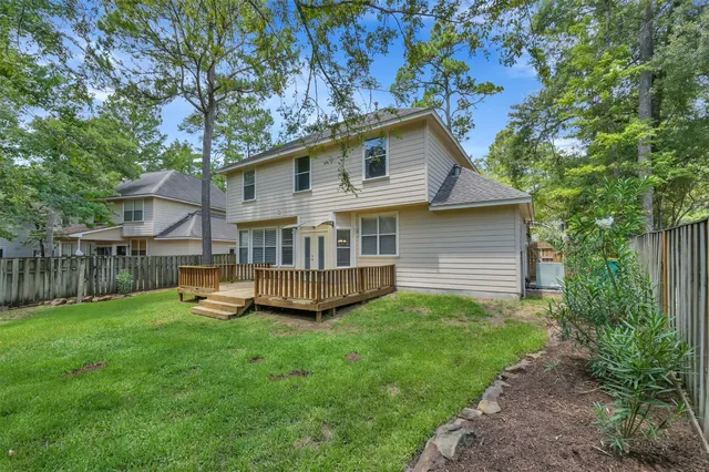 a front view of a house with a yard table and chairs