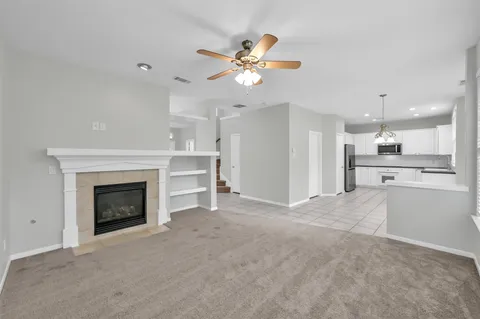 a view of an empty room with a fireplace