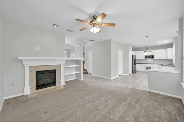 a view of an empty room with a fireplace