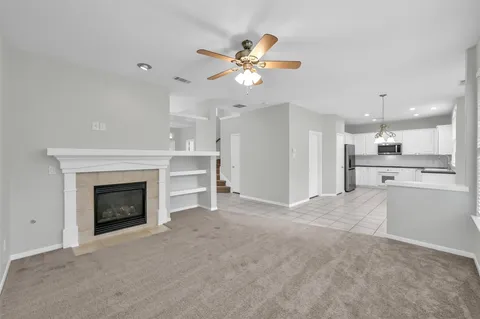 a view of an empty room with a fireplace