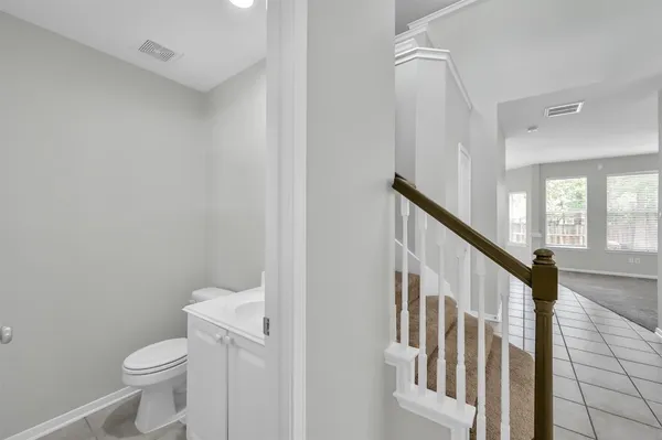 a bathroom with a toilet a sink and a shower