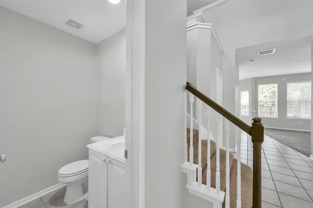 a bathroom with a toilet a sink and a shower