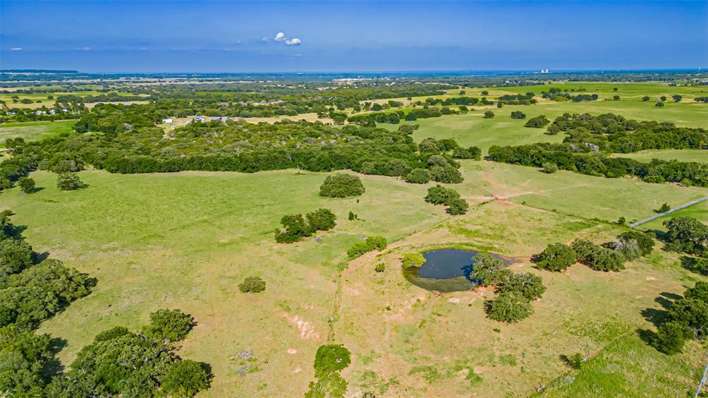 7601 Panther Branch Road Tolar, TX 76476 - Photo 19 of 26 a view of a lake with a yard