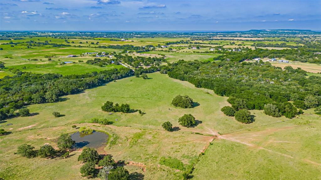 7601 Panther Branch Road Tolar, TX 76476 - Photo 20 of 26 a view of a yard with a swimming pool