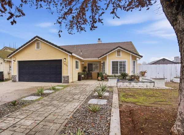 a front view of a house with swimming pool and porch