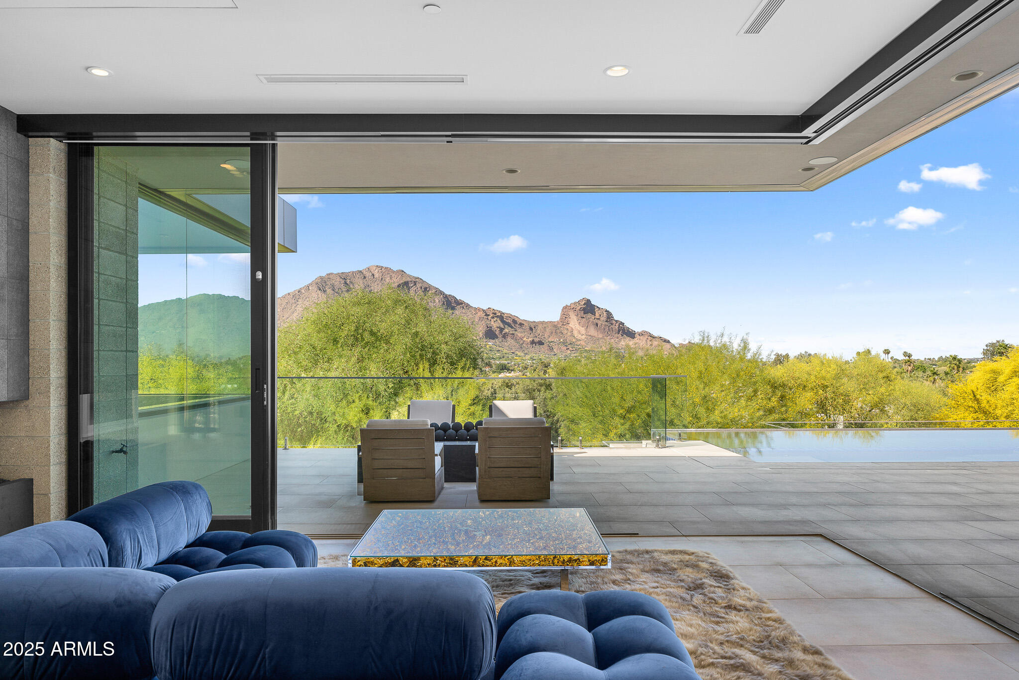 6149 East Indian Bend Road Paradise Valley, AZ 85253 - Photo 22 of 77 a living room with furniture and a large window