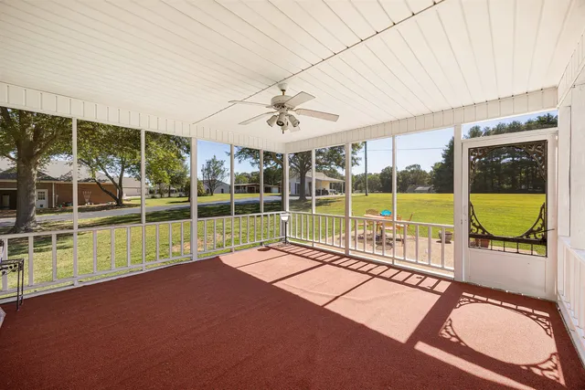 a view of a living room with a large window