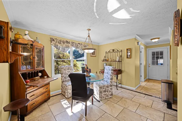 a view of a livingroom with furniture and window