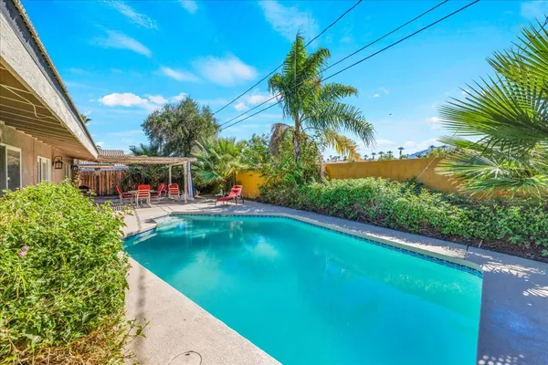 a view of swimming pool with a yard