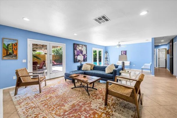 a living room with furniture and a rug
