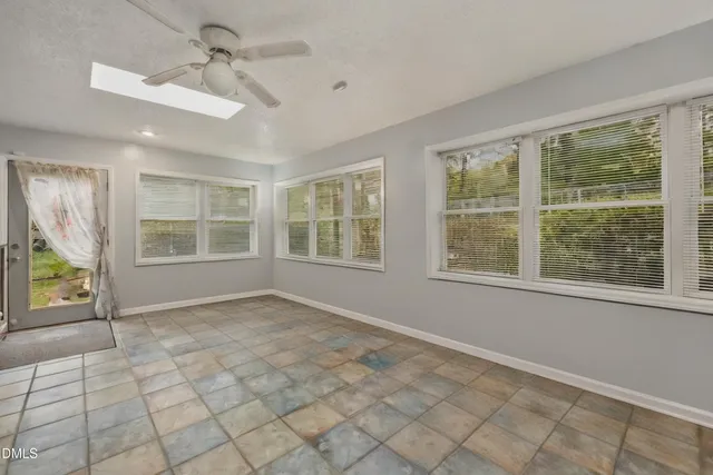 a view of an empty room with windows