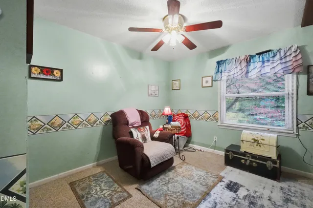 an aerial view of a house with swimming pool and garden