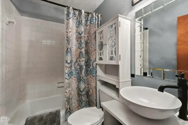 a sign that is in front of a tree