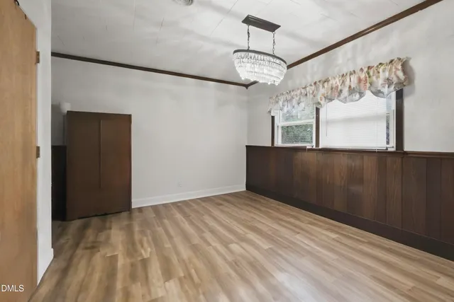 a view of a house with backyard sitting area and garden