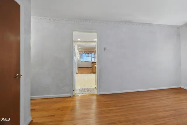 a kitchen with stainless steel appliances granite countertop a sink a stove and a refrigerator with wooden cabinets