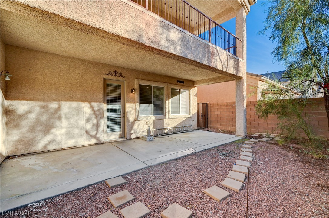 6761 Clay TABLET Street Las Vegas, NV 89149 - Photo 67 of 73 An inviting covered patio opens to a private yard with a stepping stone path.