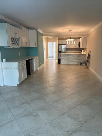a view of kitchen with furniture and window