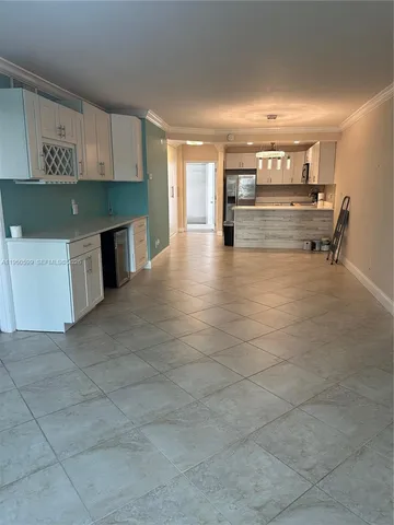 a view of kitchen with furniture and window