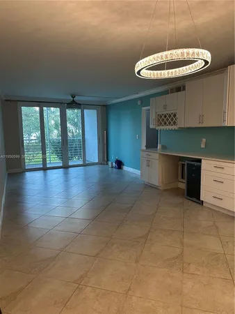 a view of a kitchen with a sink and a fireplace