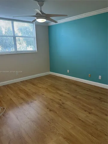 a view of an empty room with a window