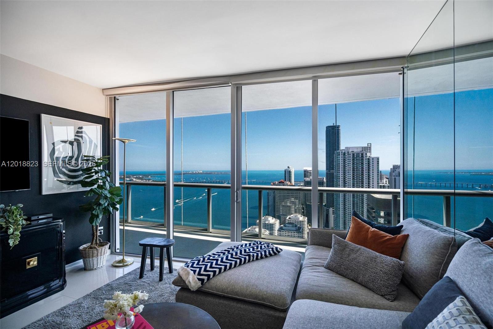 495 Brickell Avenue, Unit 4911 Miami, FL 33131 - Photo 4 of 35 a balcony with furniture and a potted plant