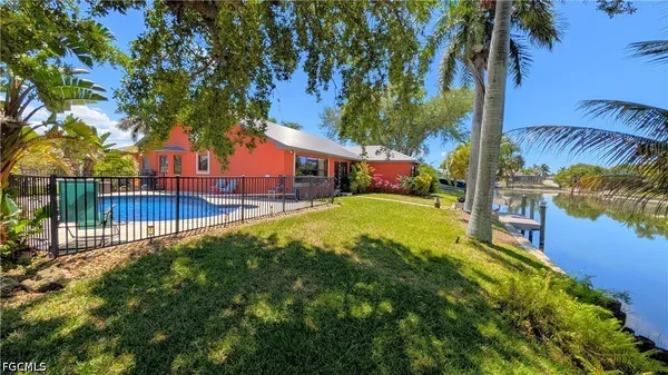 a view of a house with a yard