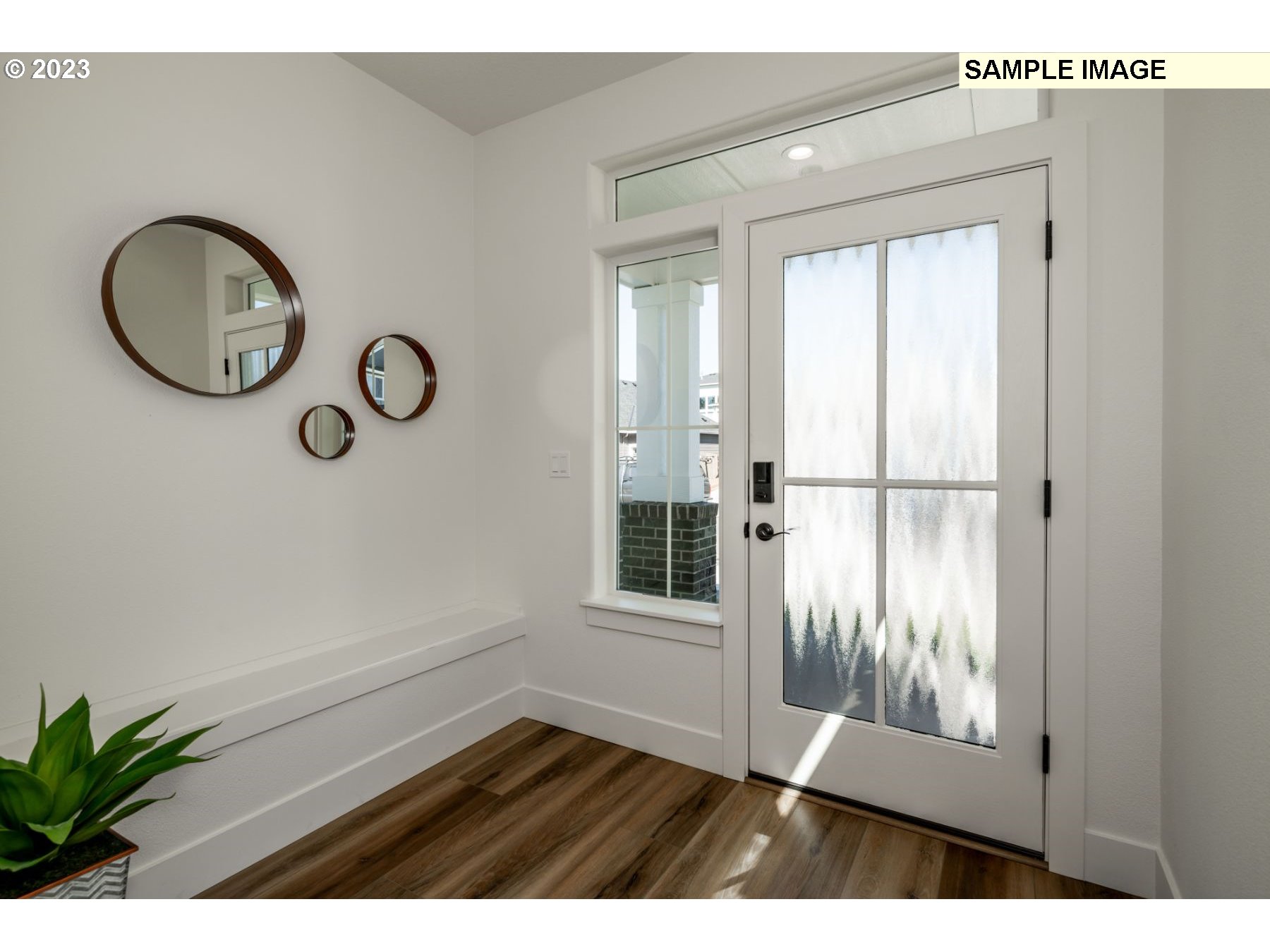 1009 Northwest 179th Street Ridgefield, WA 98642 - Photo 3 of 24 a view of a room with wooden floor and windows