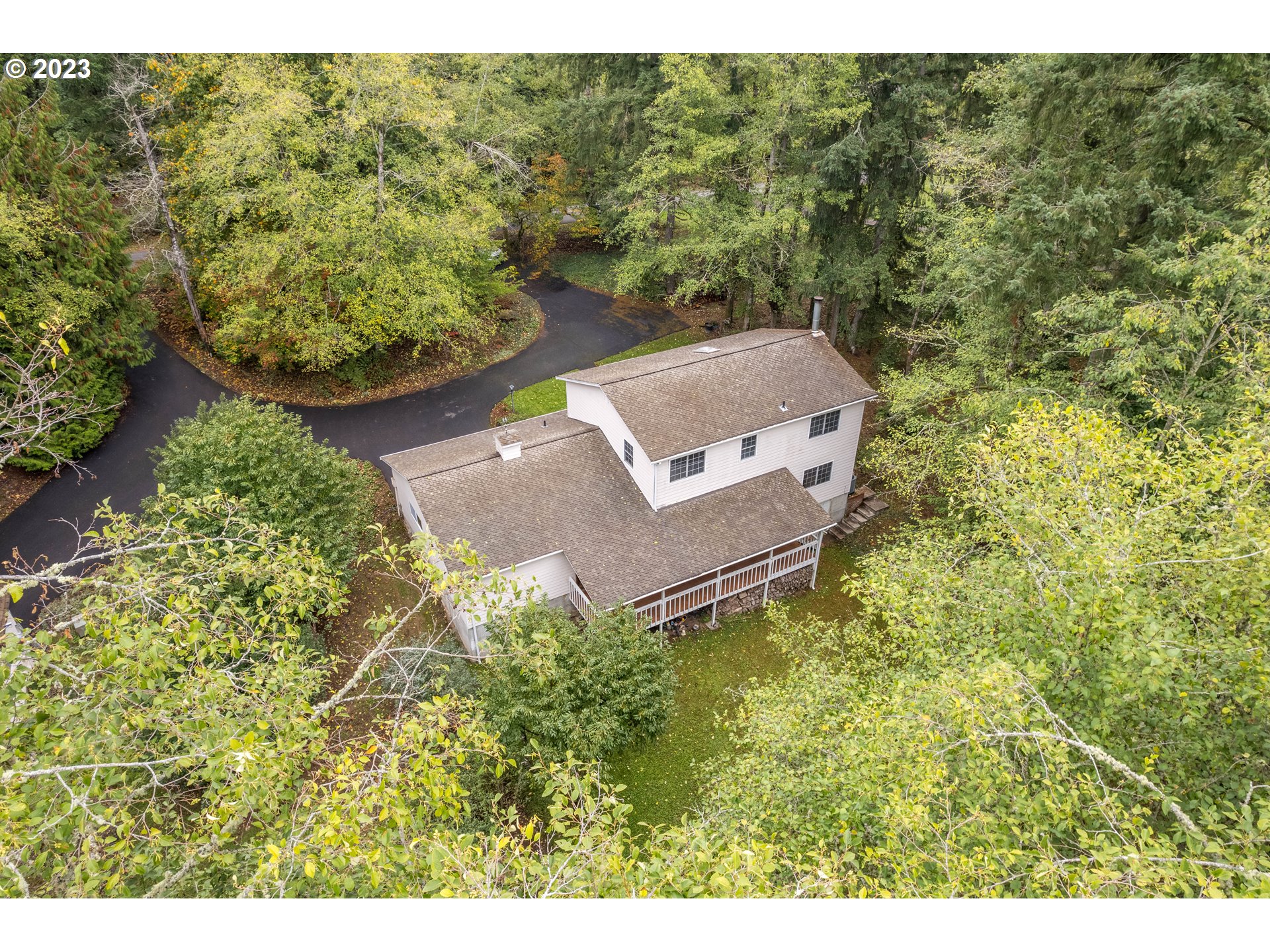 234 Walker Road Kelso, WA 98626 - Photo 29 of 35 a aerial view of a house with a yard and large trees
