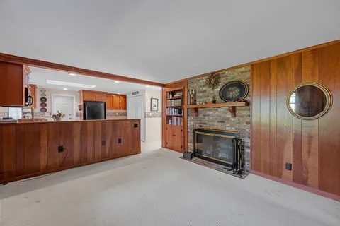 a view of a livingroom with furniture and a fireplace