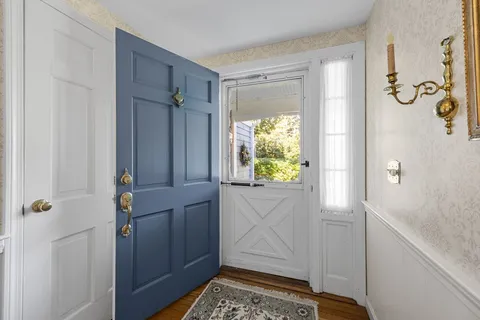 a bathroom with a window and a shower
