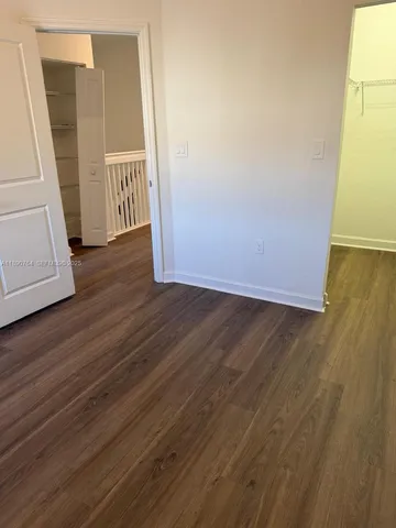 a view of front door with wooden floor