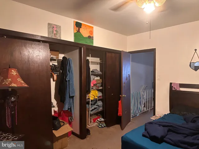 a view of a livingroom with furniture and closet