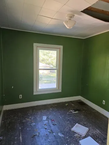 a view of a room that has a window in it