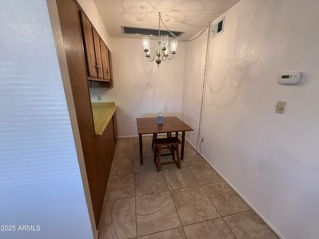 a view of a hallway with furniture
