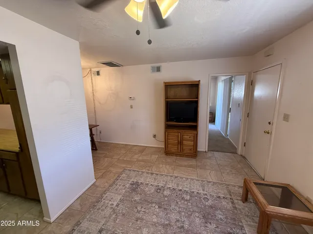 a view of hallway with a bathroom