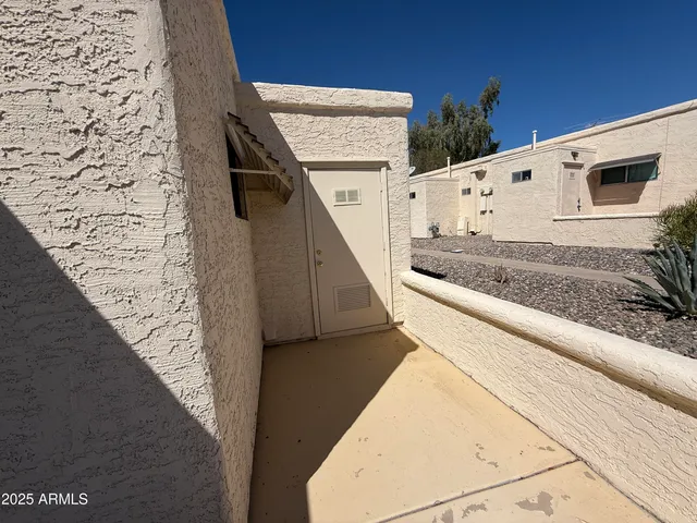 a view of a balcony with furniture