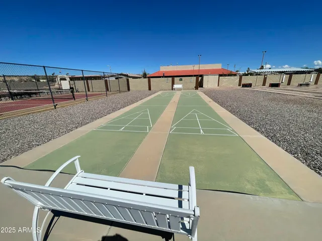 a view of a balcony with two chairs