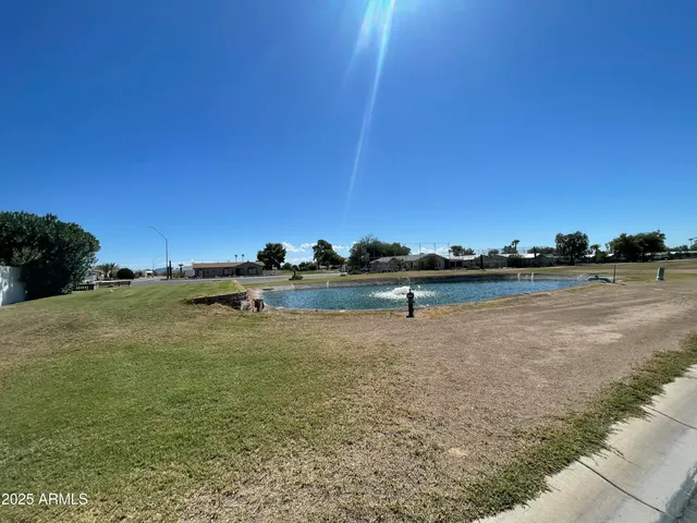 a view of swimming pool with a yard