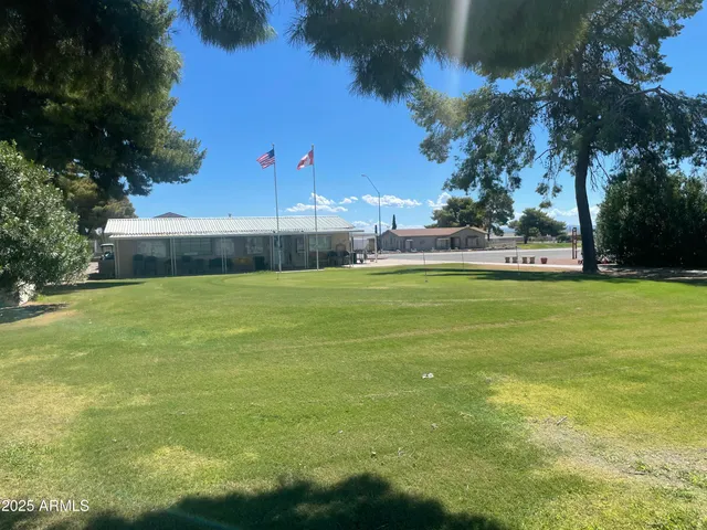 a view of a swimming pool with an outdoor space and seating area