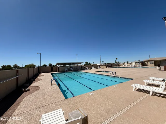 a view of swimming pool with lounge chair