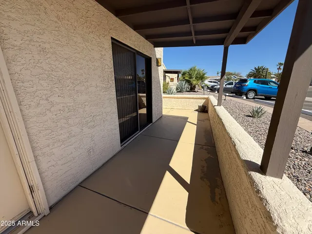 a view of balcony with wooden floor