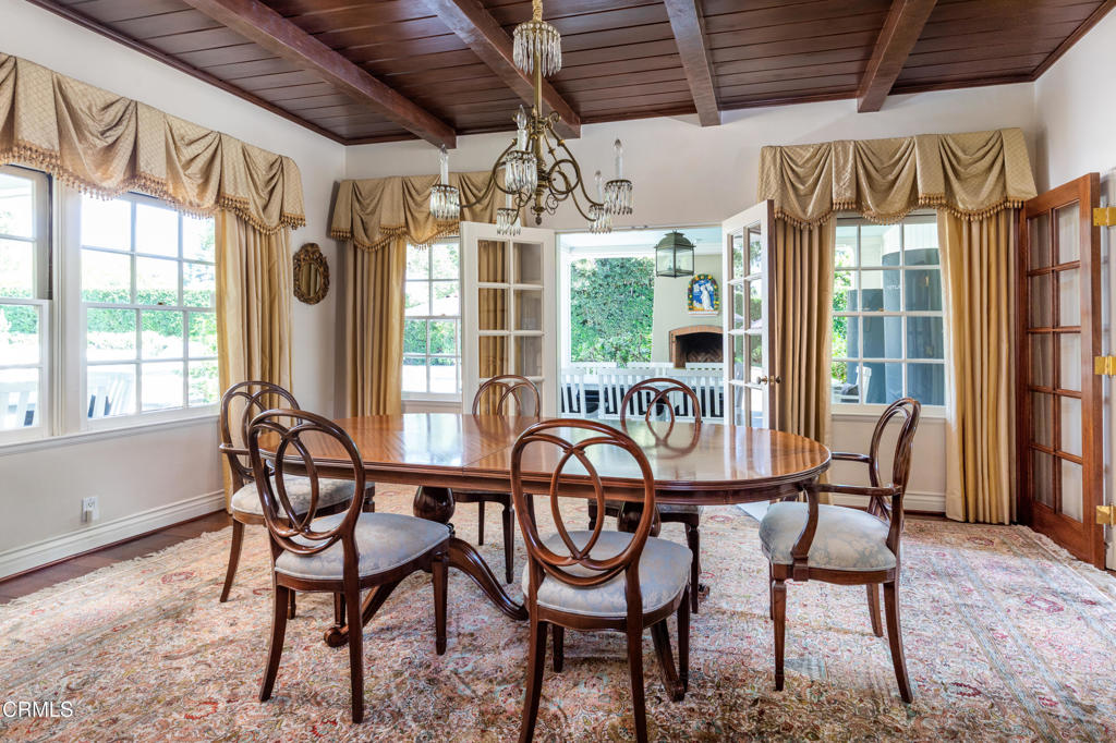 3121 Monterey Road San Marino, CA 91108 - Photo 20 of 77 a dining room with furniture a chandelier and wooden floor