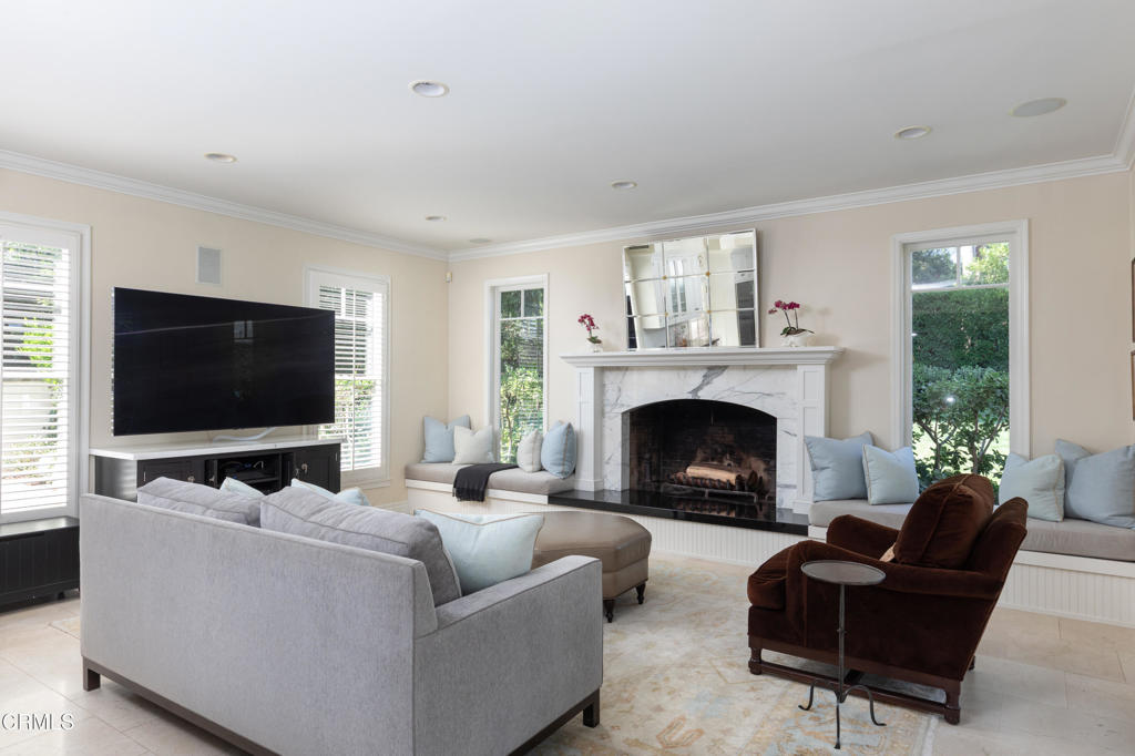 3121 Monterey Road San Marino, CA 91108 - Photo 27 of 77 a living room with furniture a flat screen tv and a fireplace